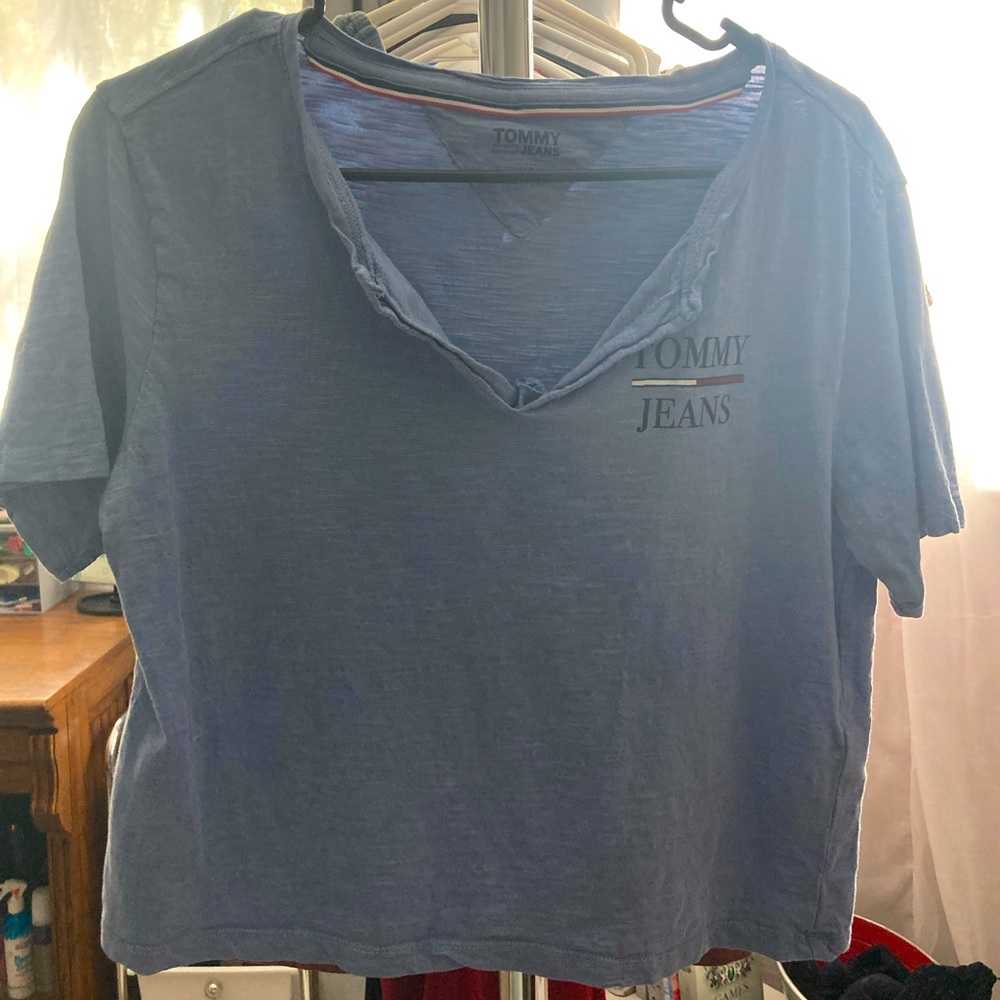 Size xs shirt. Soft blue color with black lettering on chest.